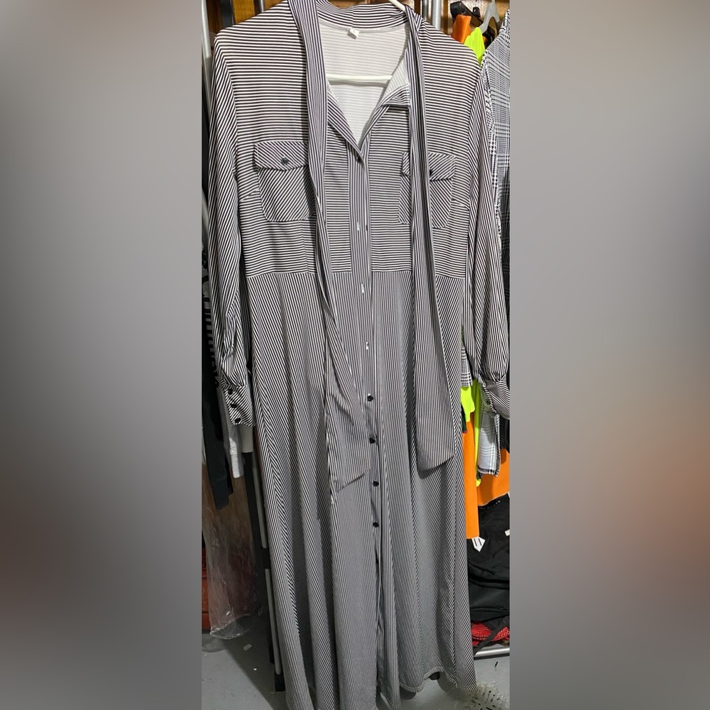 Black and white striped long sleeve maxi dress. Brand new without tags